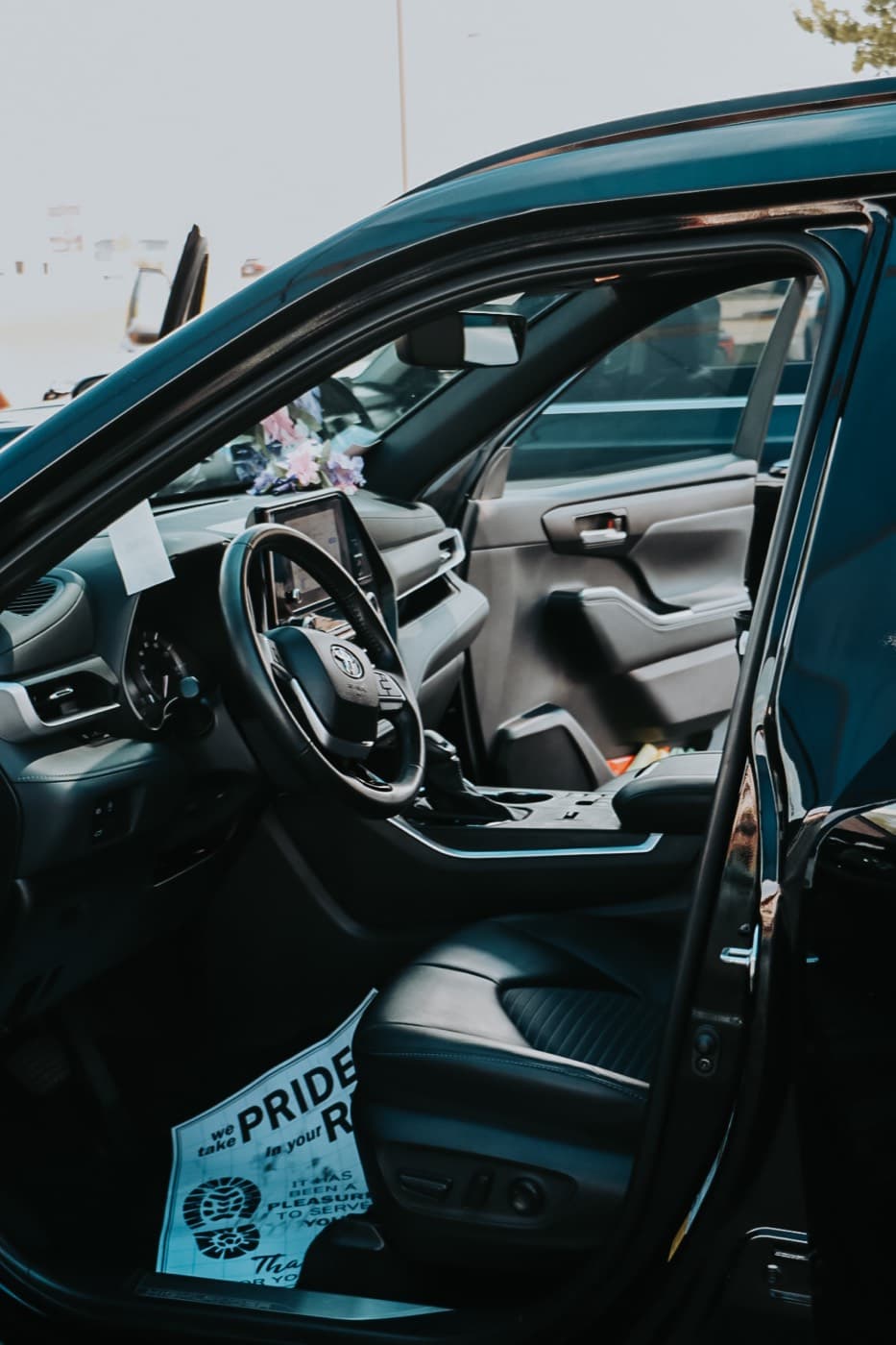 A detailed car interior with clean seats, carpet and console